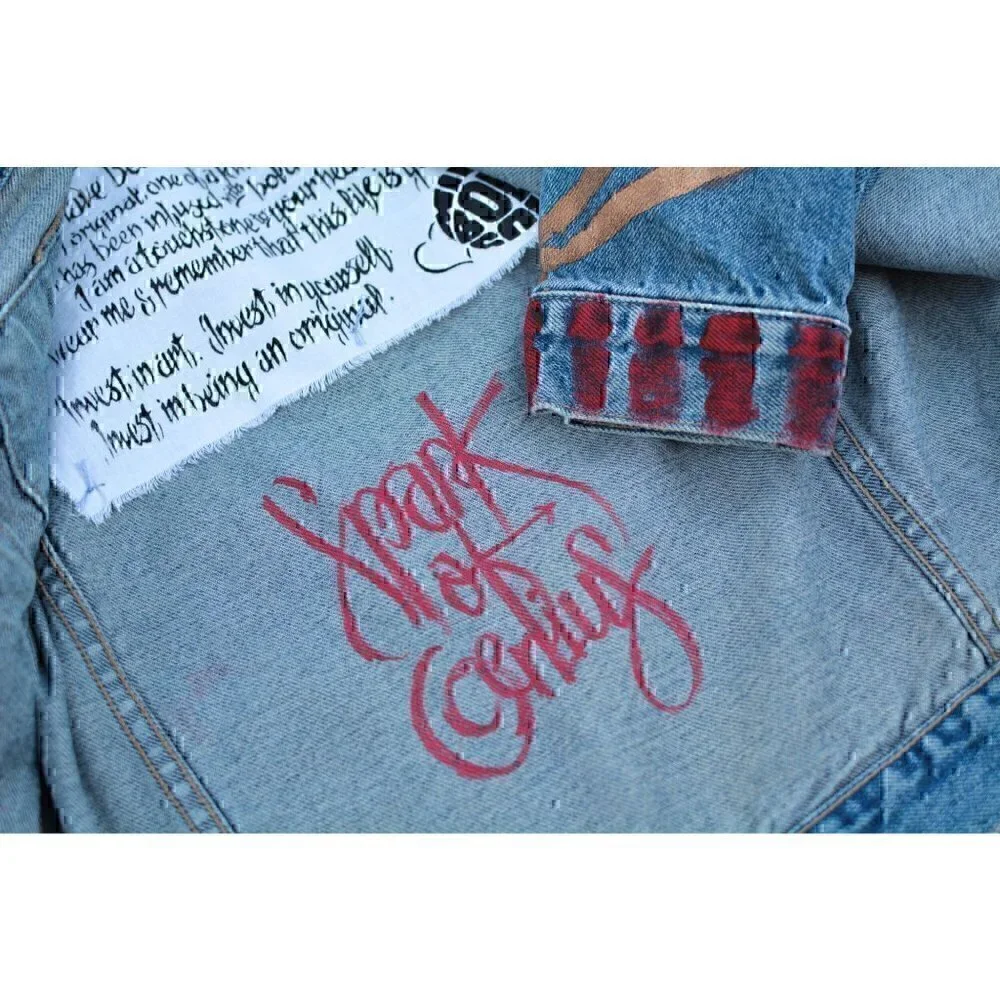 Vintage faded denim classic jean jacket. Retro cut with hand painted images